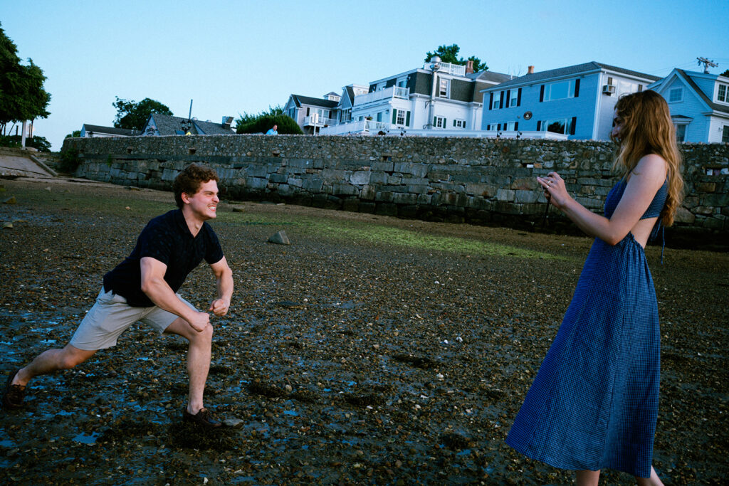 A couple taking fun photos on their engagement session. 
